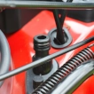 Detail of the integrated hose wash port on the Cobra MX484SPCE 48cm steel deck for easy cleaning