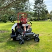 Front view of the Titan Pro 52-inch ride-on lawnmower showing the zero-turn caster wheels for unrestricted movement.