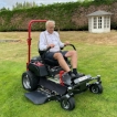 Front view of the ride-on lawnmower in action