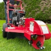 Front view showing the engine and cutting disc on the stump grinder.